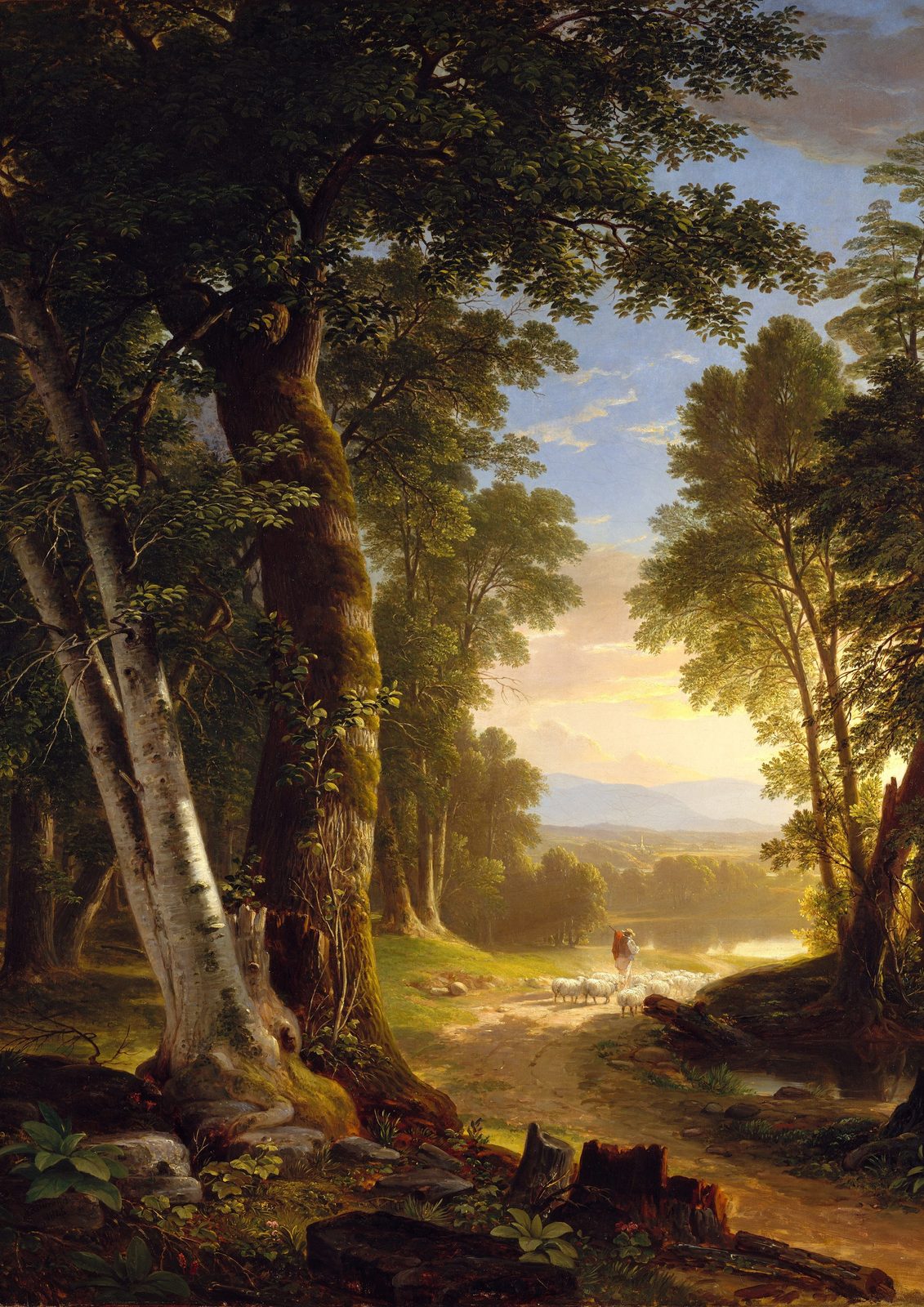 The Beeches by Asher Brown Durand, 1845. Tall beech trees frame a sunlit woodland path where a shepherd leads sheep towards meadows and blue hills, with a pale slender tree at left.