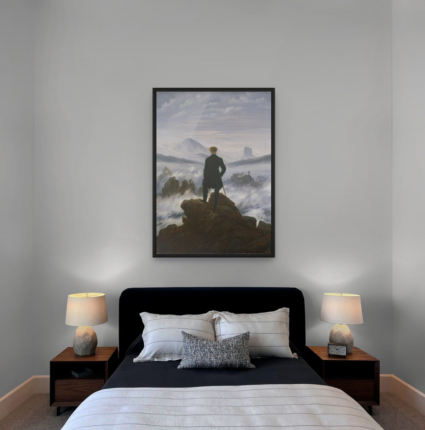 Wanderer above the Sea of Fog by Caspar David Friedrich as a framed print in a black frame above a bed